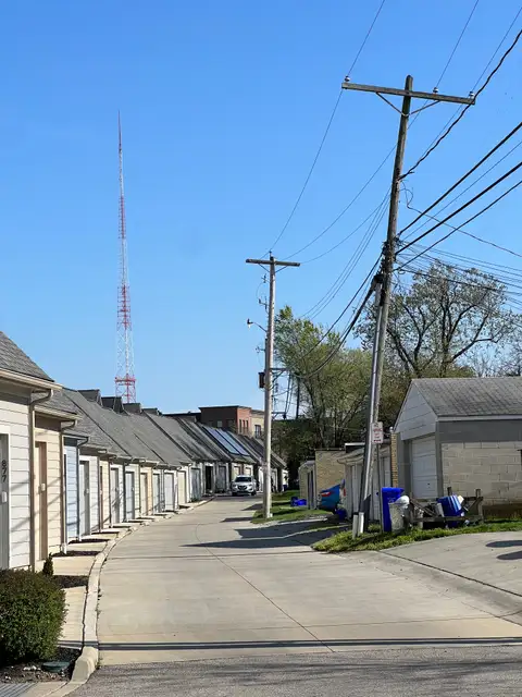 Blue skies and quiet city backstreets.